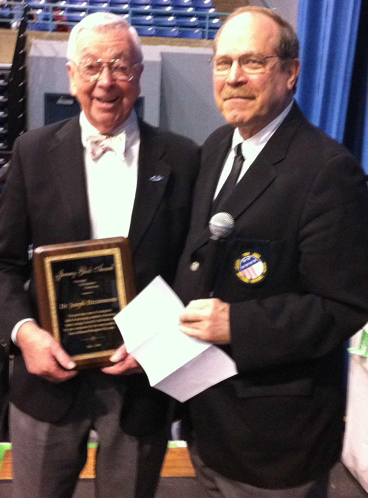 Dr. Fitzimmons receiving award from Neil Simon