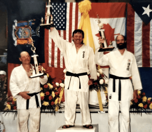 John earned a gold medal in the Am–Can Challenge in 1990–1991