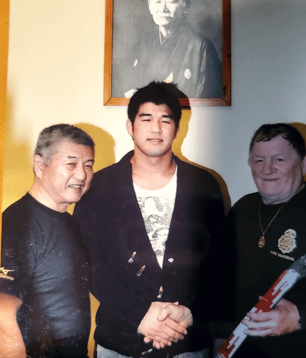 John with Sensei Shiina and Kasei Inove (2000 Summer Olympoc Gold medalist) as he received his Shichidan, 7th degree black belt, at the age of 70