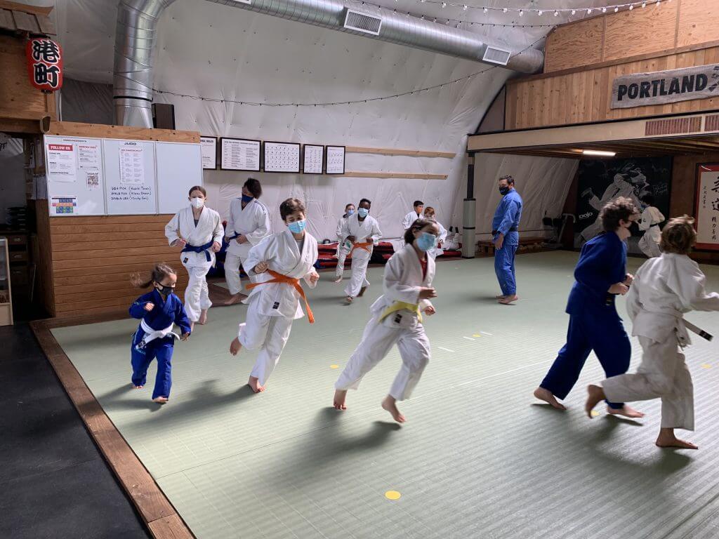 Portland judo club kids running on mat