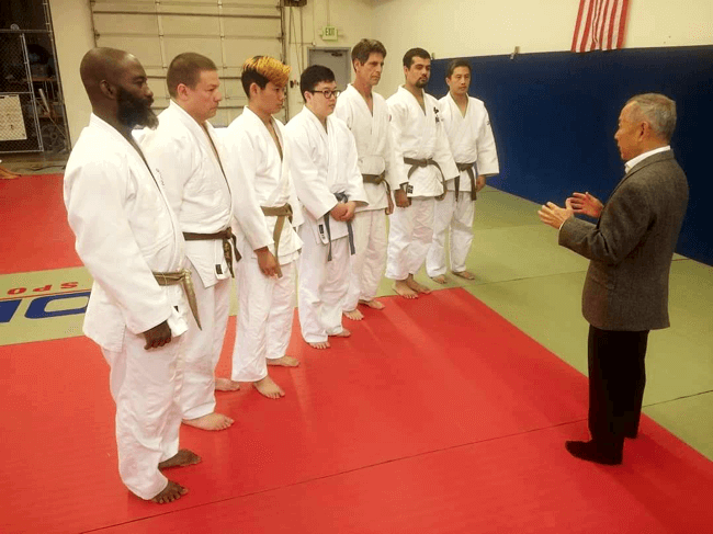 Vaughn Imada imparting USJF high standards to newly minted Shodan at one of Cenco's promotional events