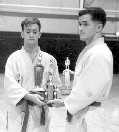 Navy team member, Ron Johnson, and Michael Pratt, trophies from Sasabo Japan