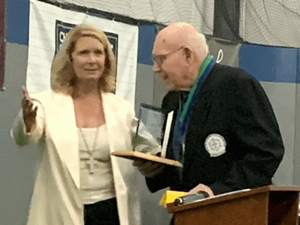 At the Salinas Valley Sports Hall of Fame, Erin Clark, co-anchor of KSBW action news, is presenting the award to Ferd Tihista