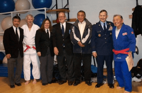 Karl Tamai, Tad Nalls, Sharon Landstreet, Roy Englert, Dick Hugh, John Hesterman and Jimmy Takemori at the awarding of an honorary IJF-A referee certificate to Jimmy Takemori.